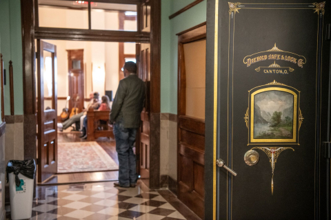 An original 1895 custom painting on a Diebold vault door was restored under layers of white paint. Photo by Joe Duty