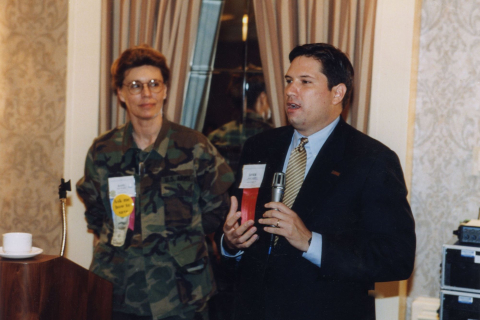 Javier Gonzales (right) speaks about domestic security after the Sept. 11, 2001 terrorist attacks as Past President Kay Braaten looks on. 