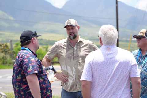 John Smith, administrator of the Maui County Office of Recovery, talks to Association of Oregon Counties Legislative Affairs Manager Branden Pursinger (left) and Holt County, Neb. Commissioner Bill Tielke outside of the Maria Lanakila Catholic Church in Lahaina’s historic district, which survived the fire. Photo by Charlie Ban
