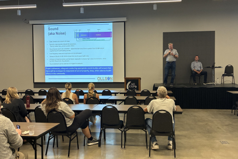 Environmental health scientist Chris Ollson addresses a McKenzie County, N.D., open house on data center regulation in September 2026. To his left is acoustic specialist Ryan Callahan. Photo courtesy of McKenzie County