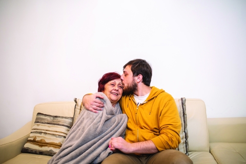 Image of GettyImages-1095974162_hug-on-couch_cmyk.jpg